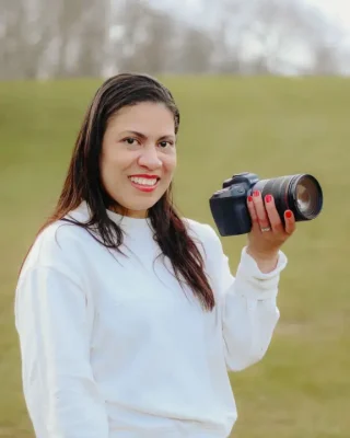 Merlin smiling with her camera in color