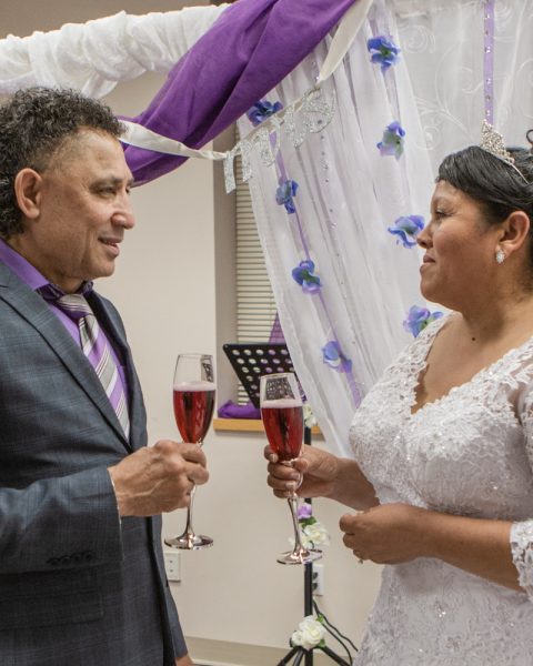 Bride and Groom holding classes and looking at each other