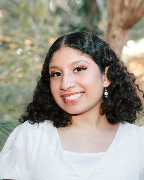 Young lady smiling with curly hair